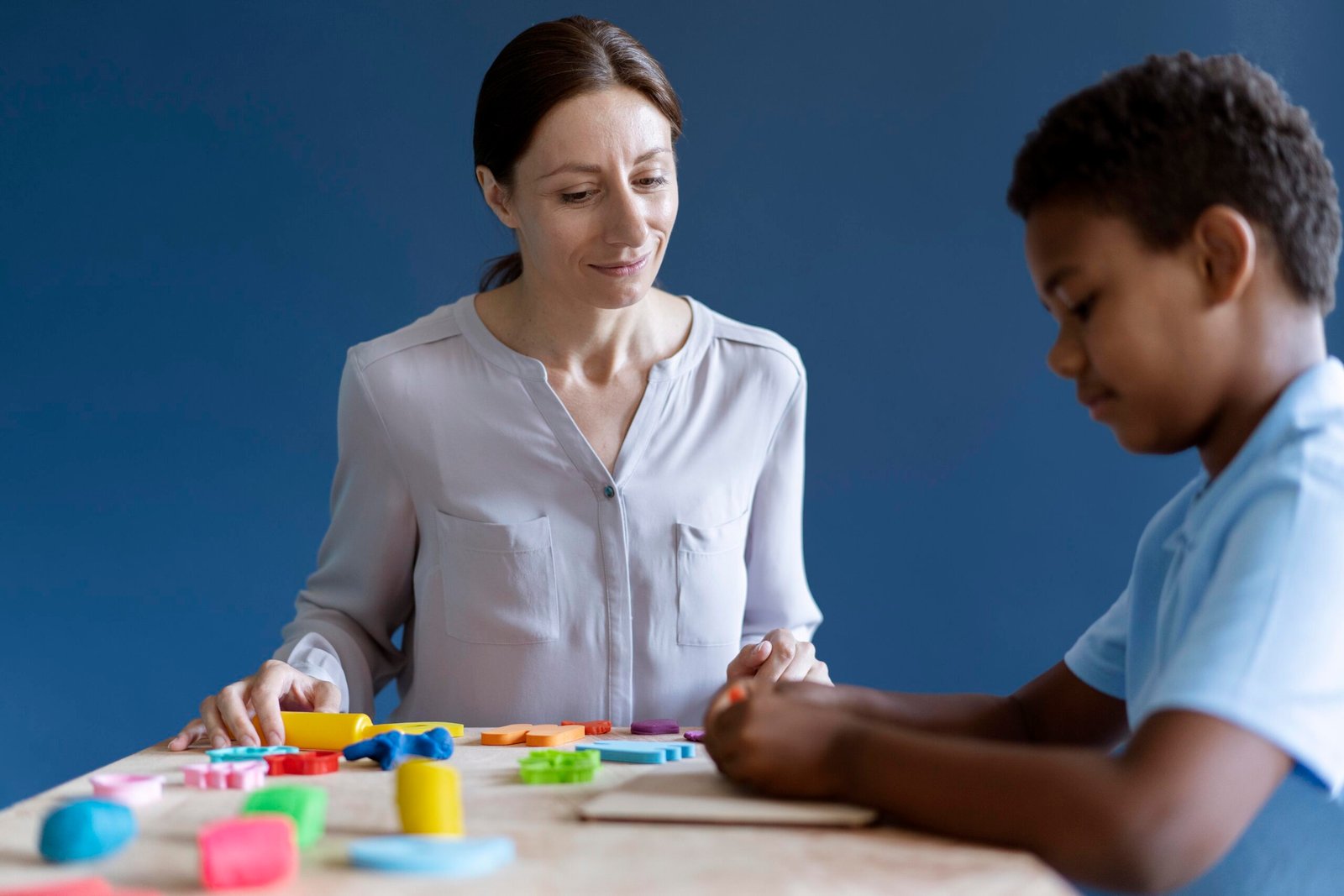 boy-doing-occupational-therapy-session-with-psychologist